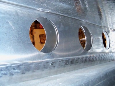 inside, slider with offset holes are sandwiched between skin and welded inner liner, all .100 and .125 alum