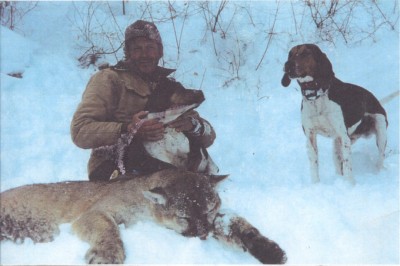 Weldon holding Rosco with the first lion I harvested in Chicken Hollow back in the day.  The other dog was let loose after the fact.