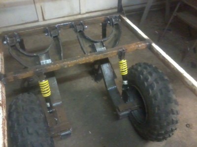 Had independent suspension that I actually modified again after this model was finished.  I lowered the deck of the trailer by moving the arms inside of the frame of the trailer and set them a little further out which made it way more stable.